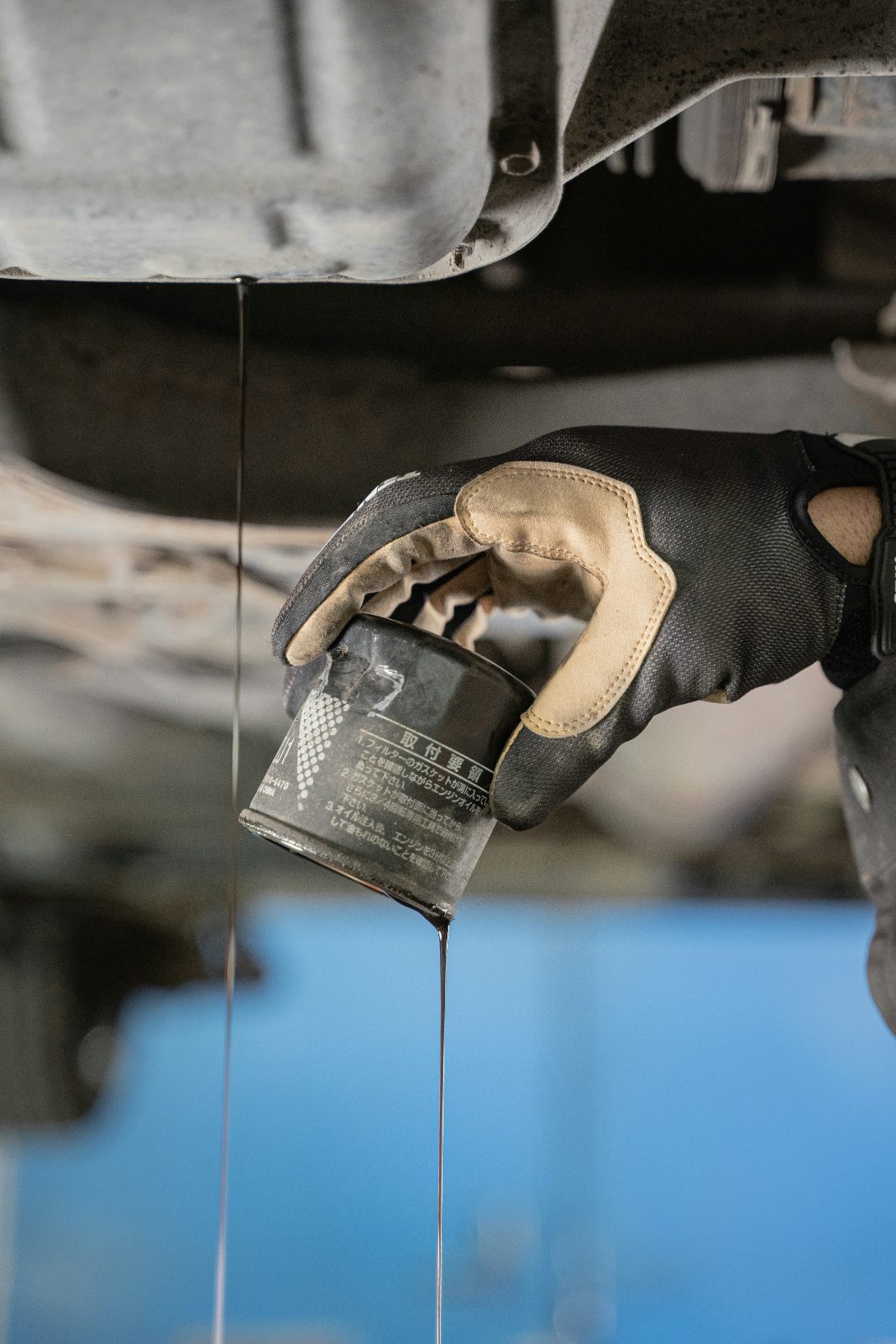 Removing the oil filter during a conventional oil change