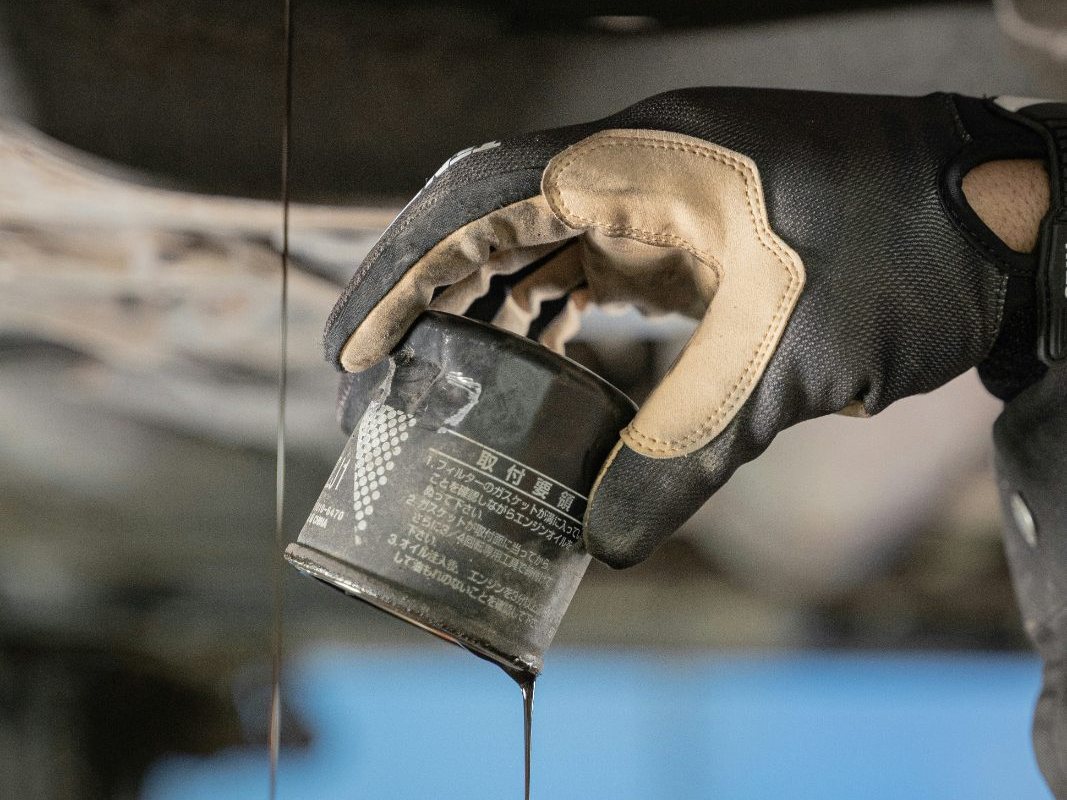 Old oil filter coming off during a conventional oil change