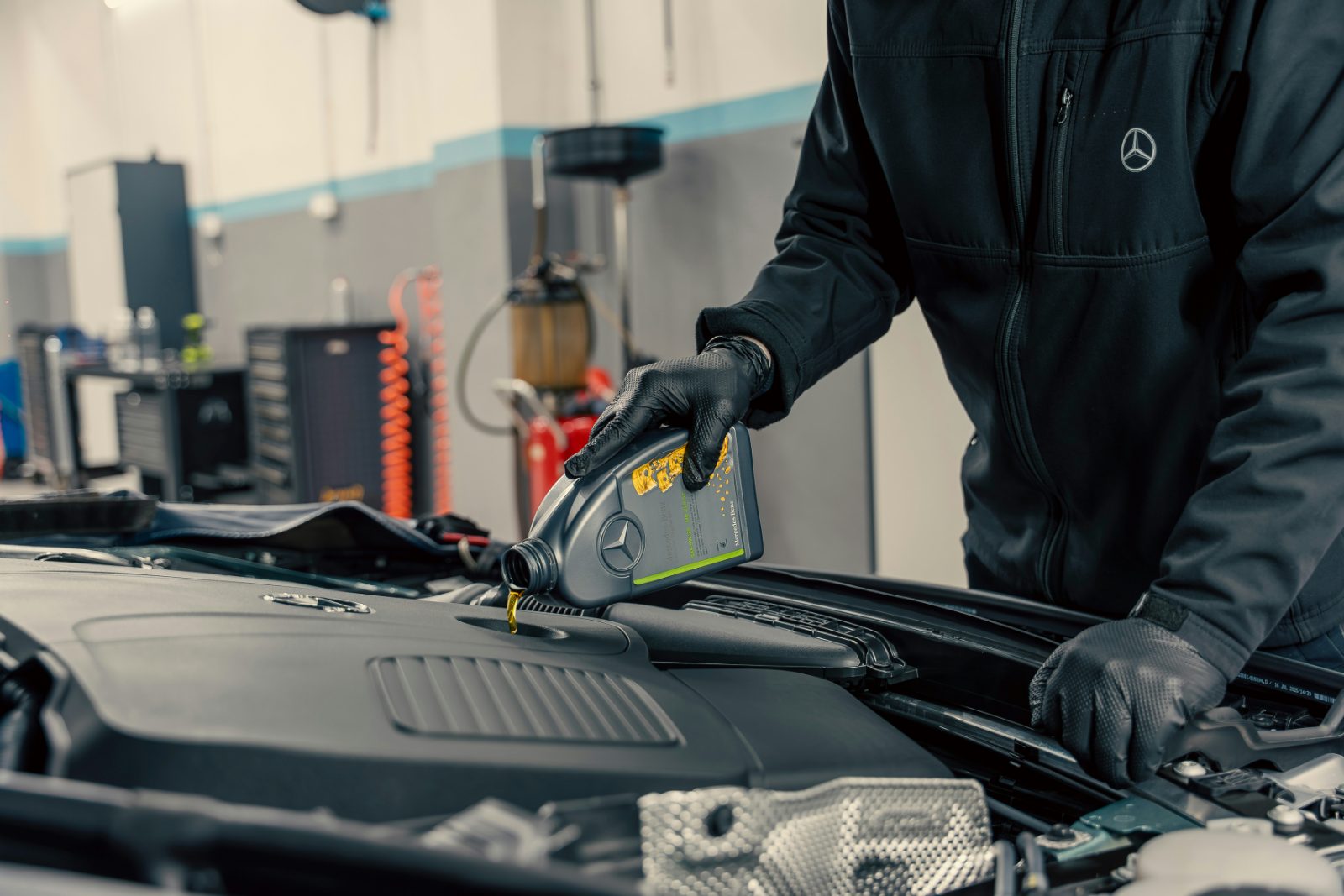 Fresh engine oil being poured during an oil change at Rexburg Oil Changes
